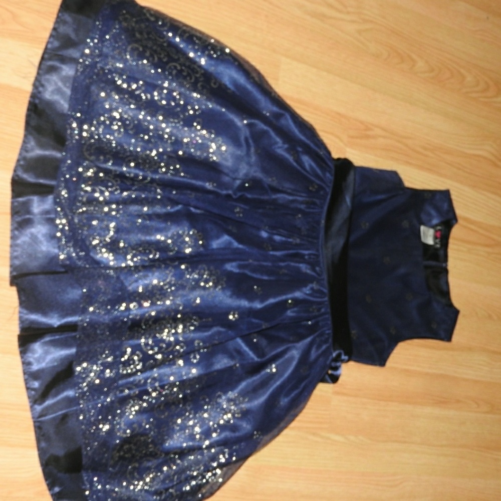A dark blue dress with silver sparkling designs.